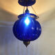 Suspension chandelier, oriental blue glass lantern and brass structure. Year 70-80