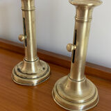 Pair of antique brass push candlesticks