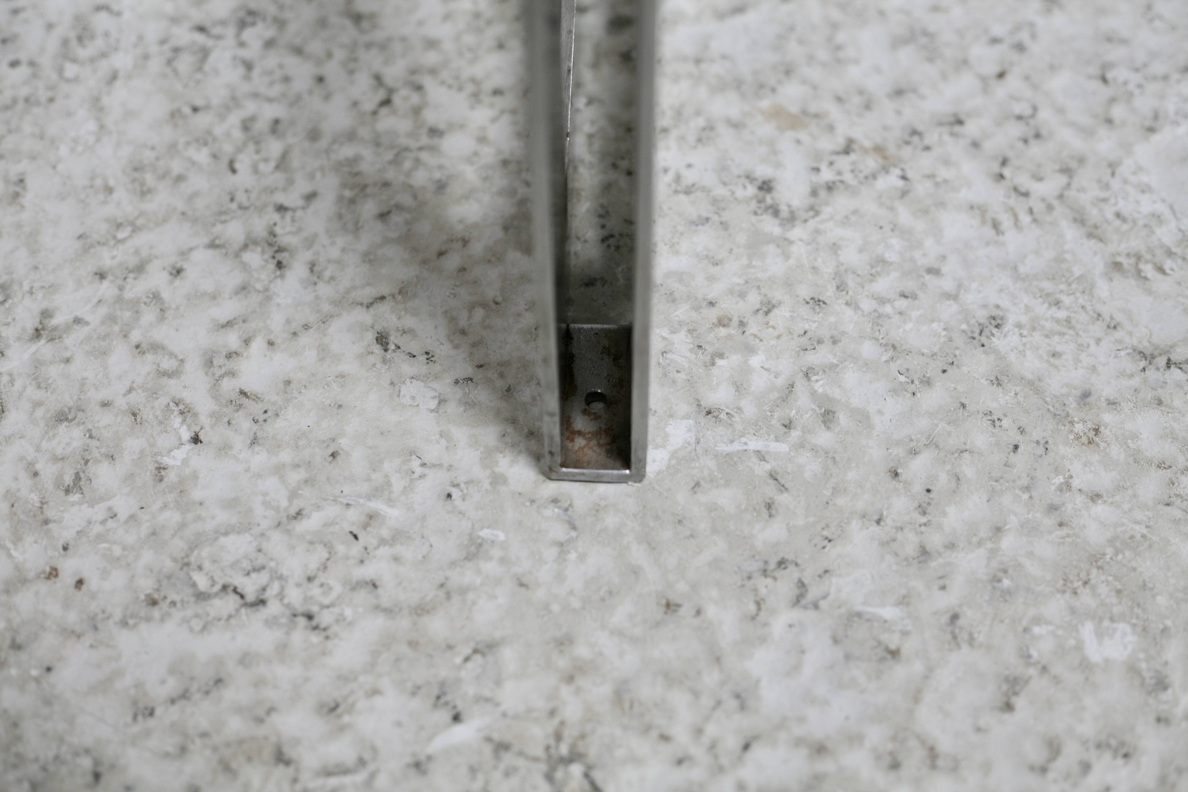 Coffee table with steel base and smoked glass slab. Circa 197