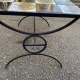 Vintage coffee table with black wrought iron and white tiles.