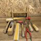 lot of antique toys, carpentry tools, wood, saw, plane, hammer,...