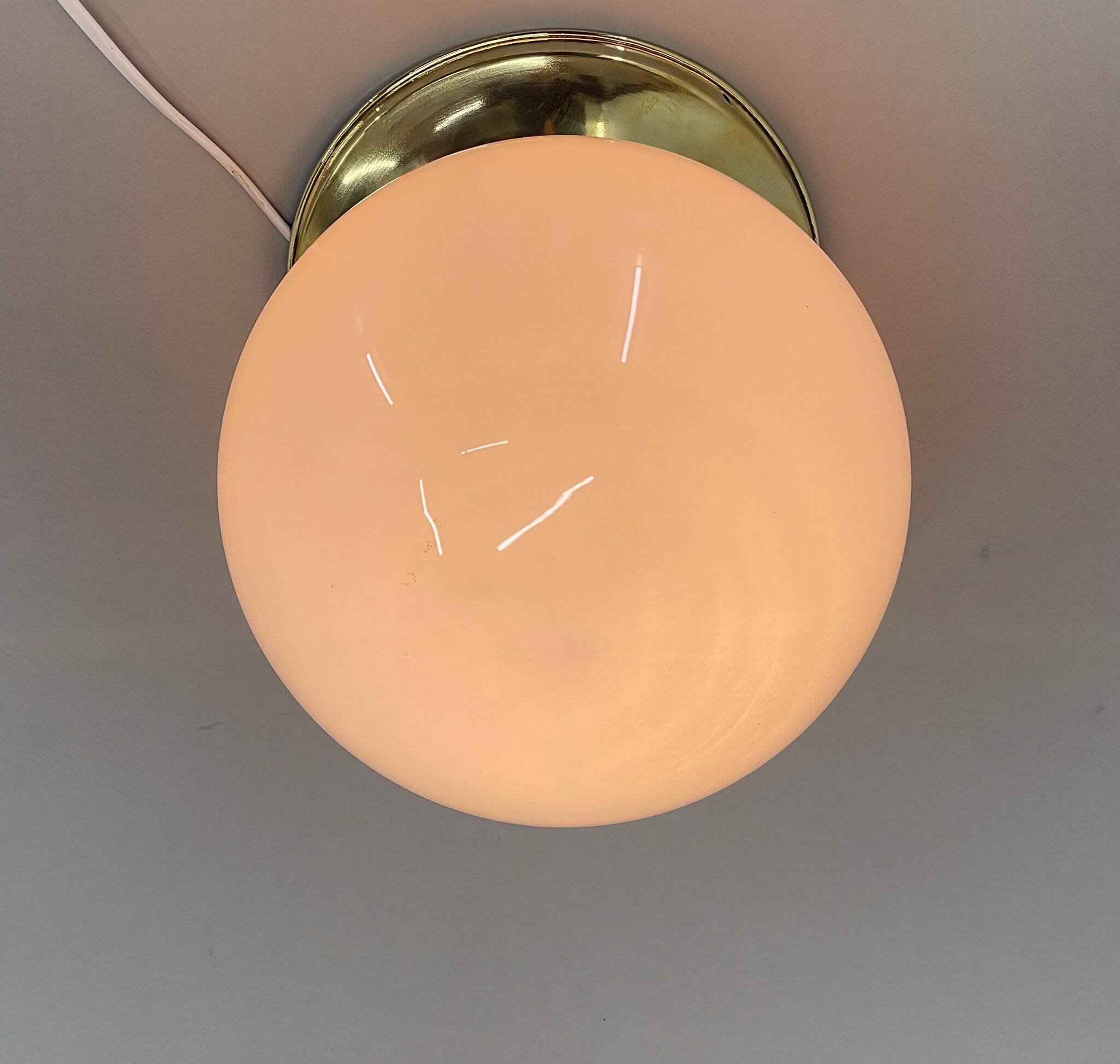 Set of three mid-century brass and milk glass ceiling ligts, restored