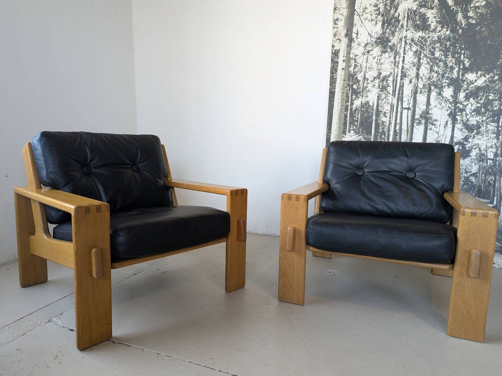 Pair of raw oak and leather armchairs by Esko Pajamies for Asko, Finland.