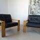 Pair of raw oak and leather armchairs by Esko Pajamies for Asko, Finland.