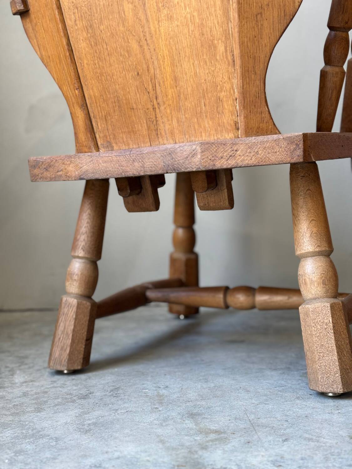 Pair of rustic oak armchairs – carved heart backrests