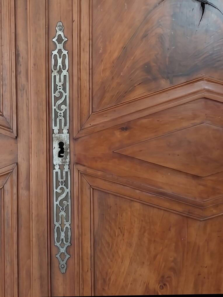 Large antique wooden wardrobe with drawer.