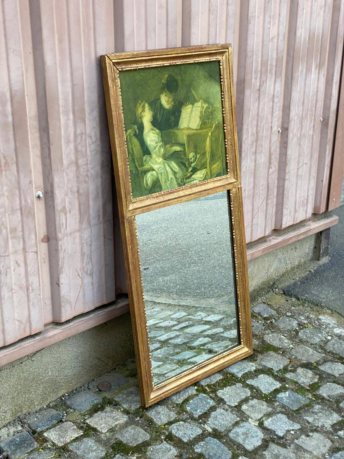 19th-century trumeau with mirror and music lesson canvas.