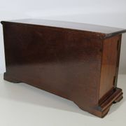 Wooden jewelry box in the shape of a dresser