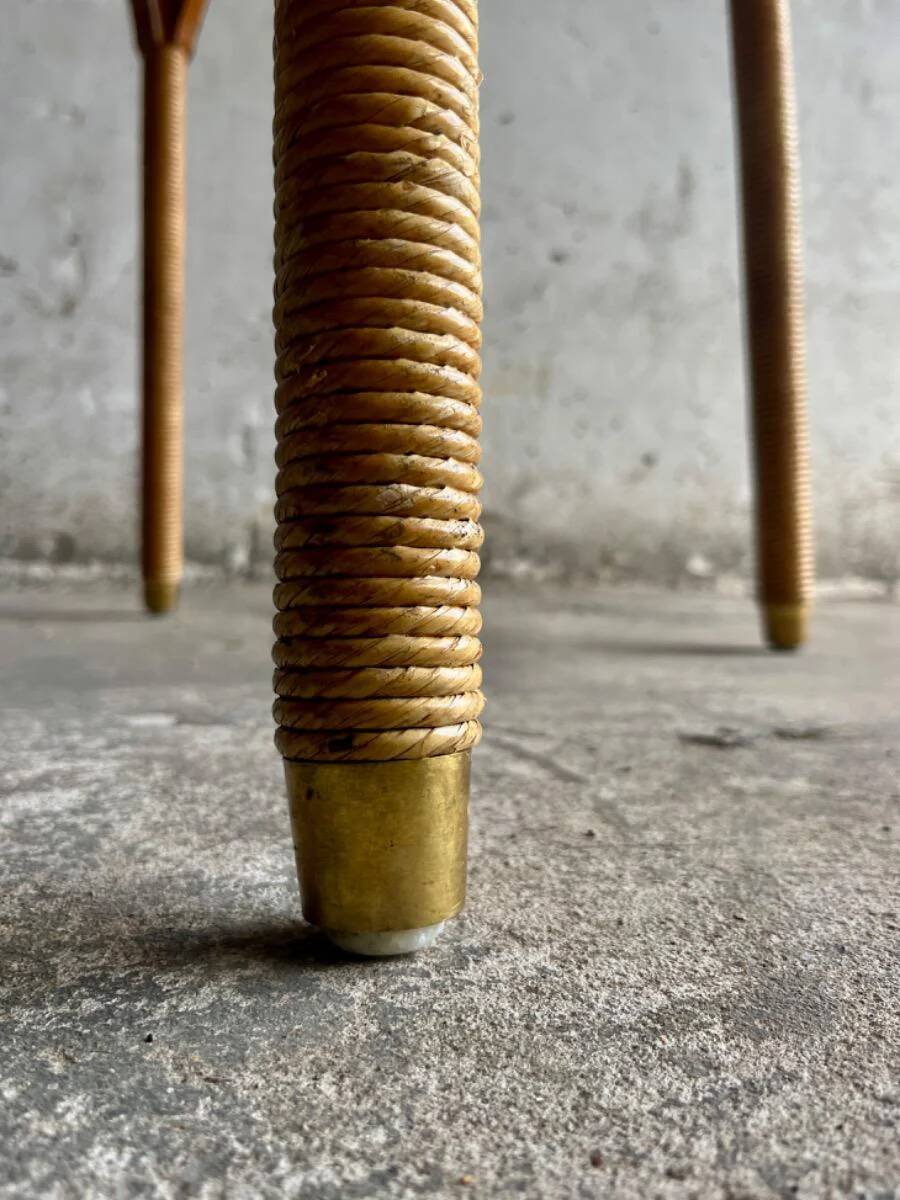 Natural Lloyd Loom paper cord rattan round table with brass-capped legs by Vincent Sheppard