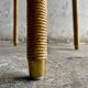 Natural Lloyd Loom paper cord rattan round table with brass-capped legs by Vincent Sheppard