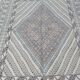 Traditional handmade Berber carpet in brown and beige wool.