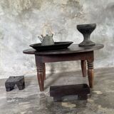 Coffee table, round antique Indonesian teak table with straight legs.
