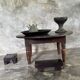 Coffee table, round antique Indonesian teak table with straight legs.