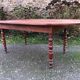 Antique cherry wood farmhouse table with rounded ends