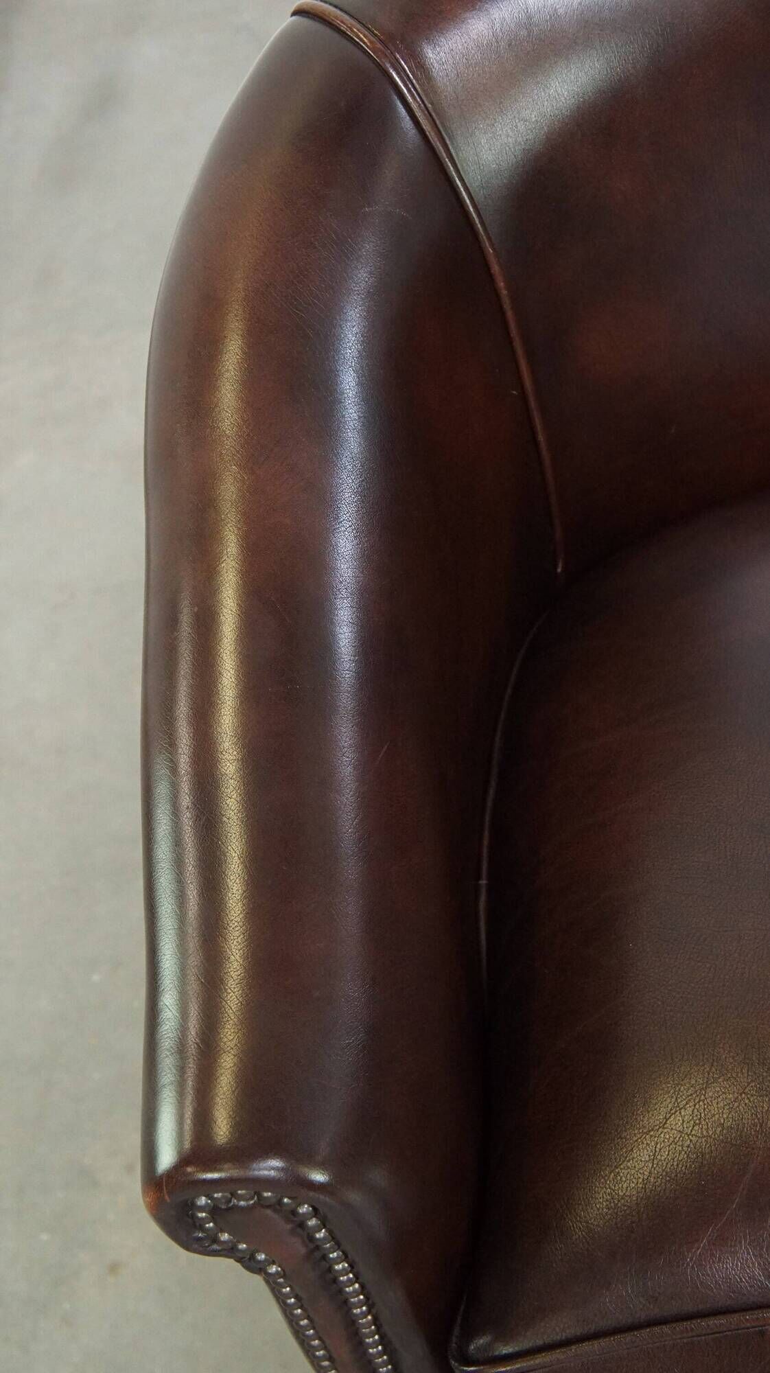 dark cowhide club chair in English style