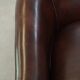dark cowhide club chair in English style