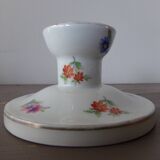 Old candle holder in flowered porcelain