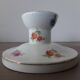 Old candle holder in flowered porcelain
