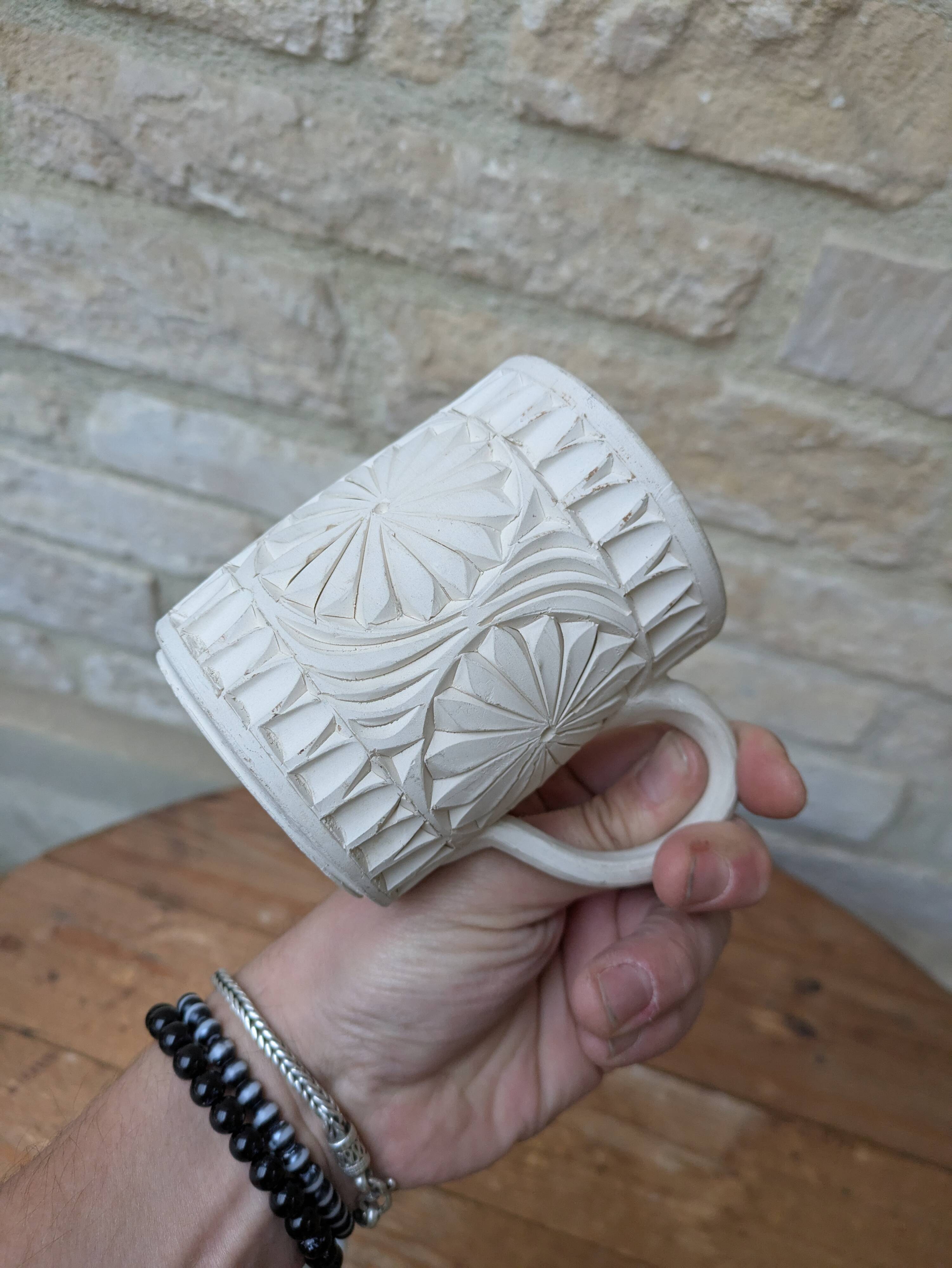 Old terracotta mug with glazed interior