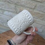 Old terracotta mug with glazed interior