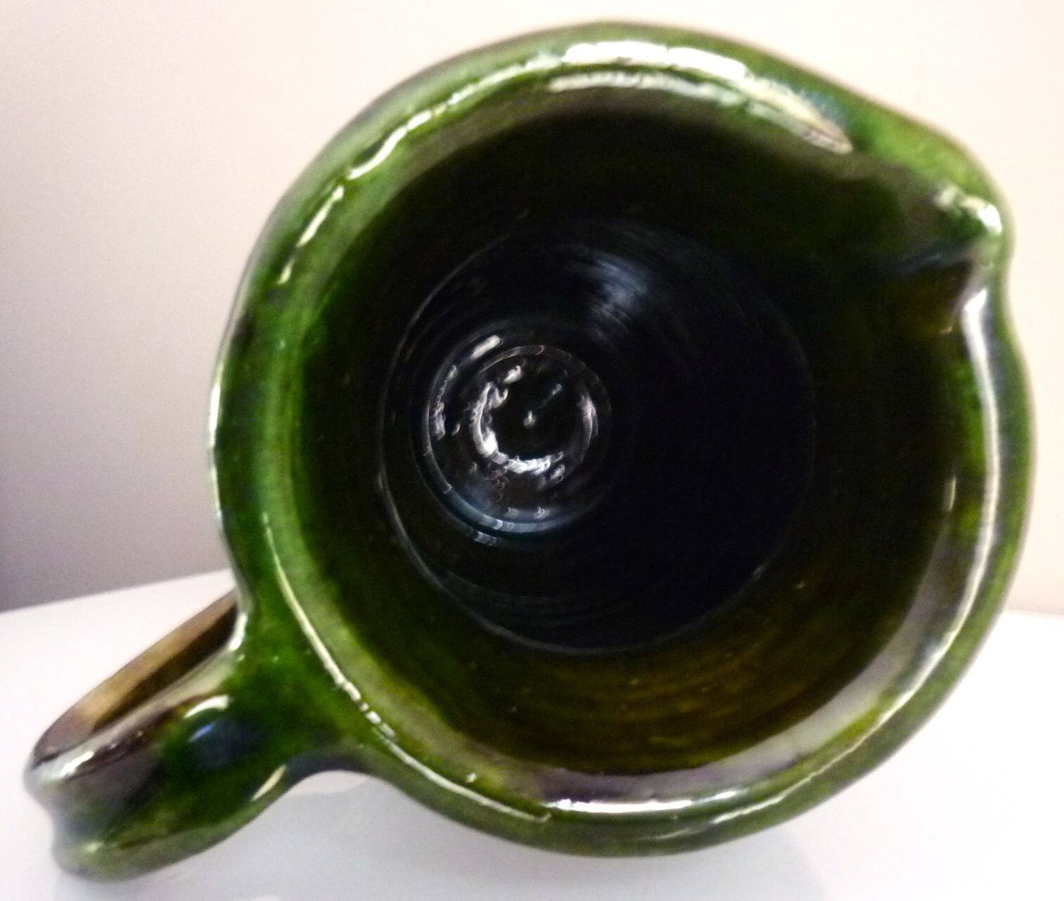 Pitcher vase, thick green glazed terracotta, signature to be identified