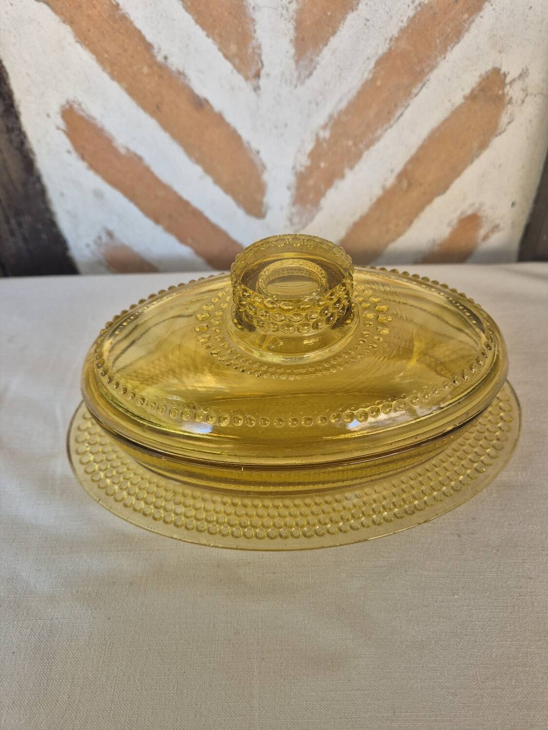 Amber glass butter dish, 1940