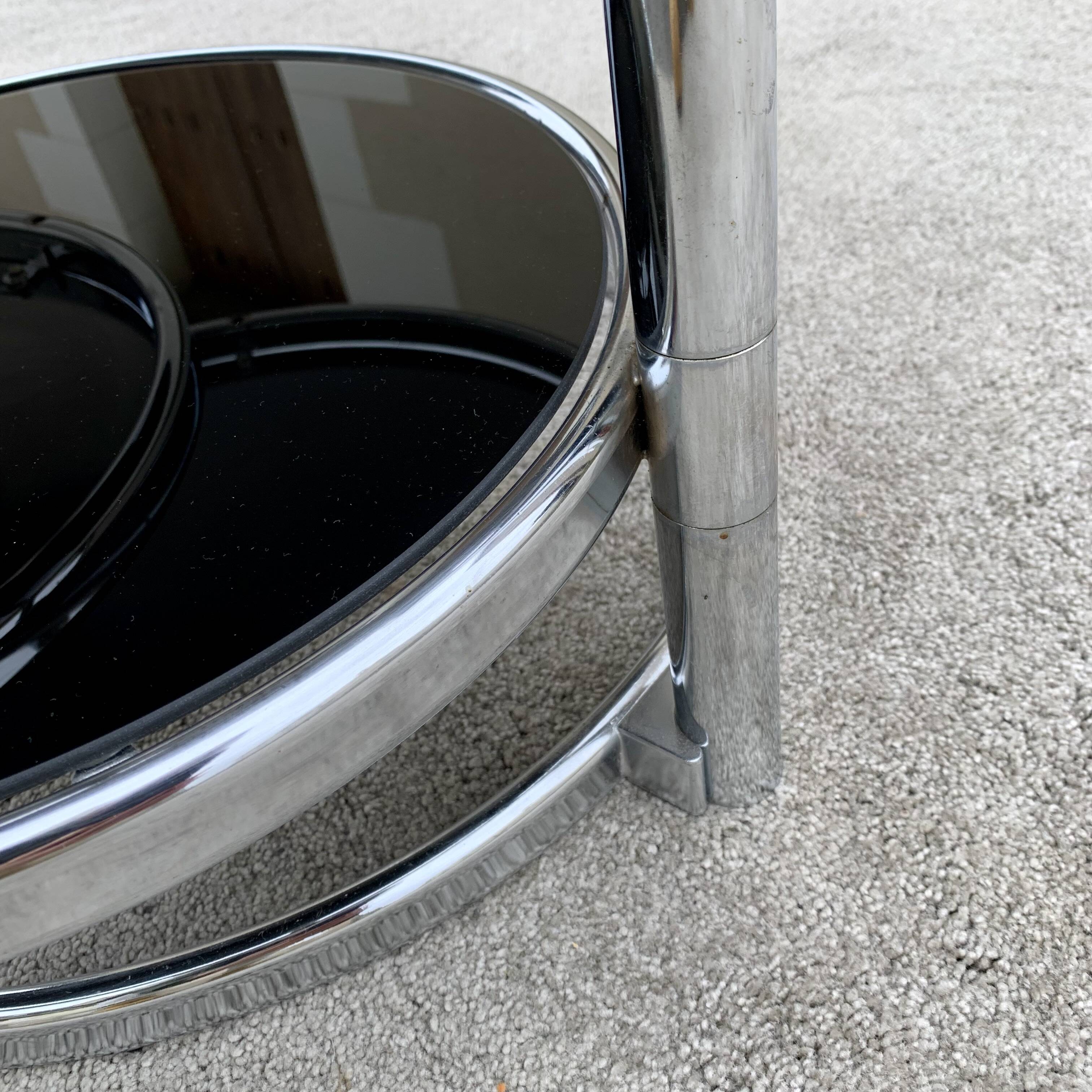 Articulated coffee table with 3 shelves, black glass and chrome, 1980