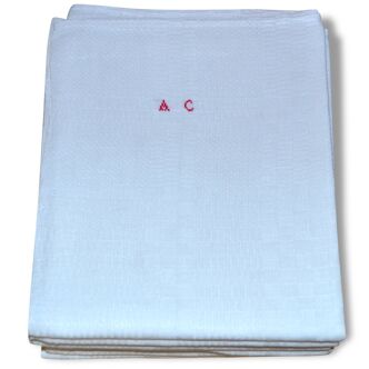 Suite of six former cloths, red AC monograms