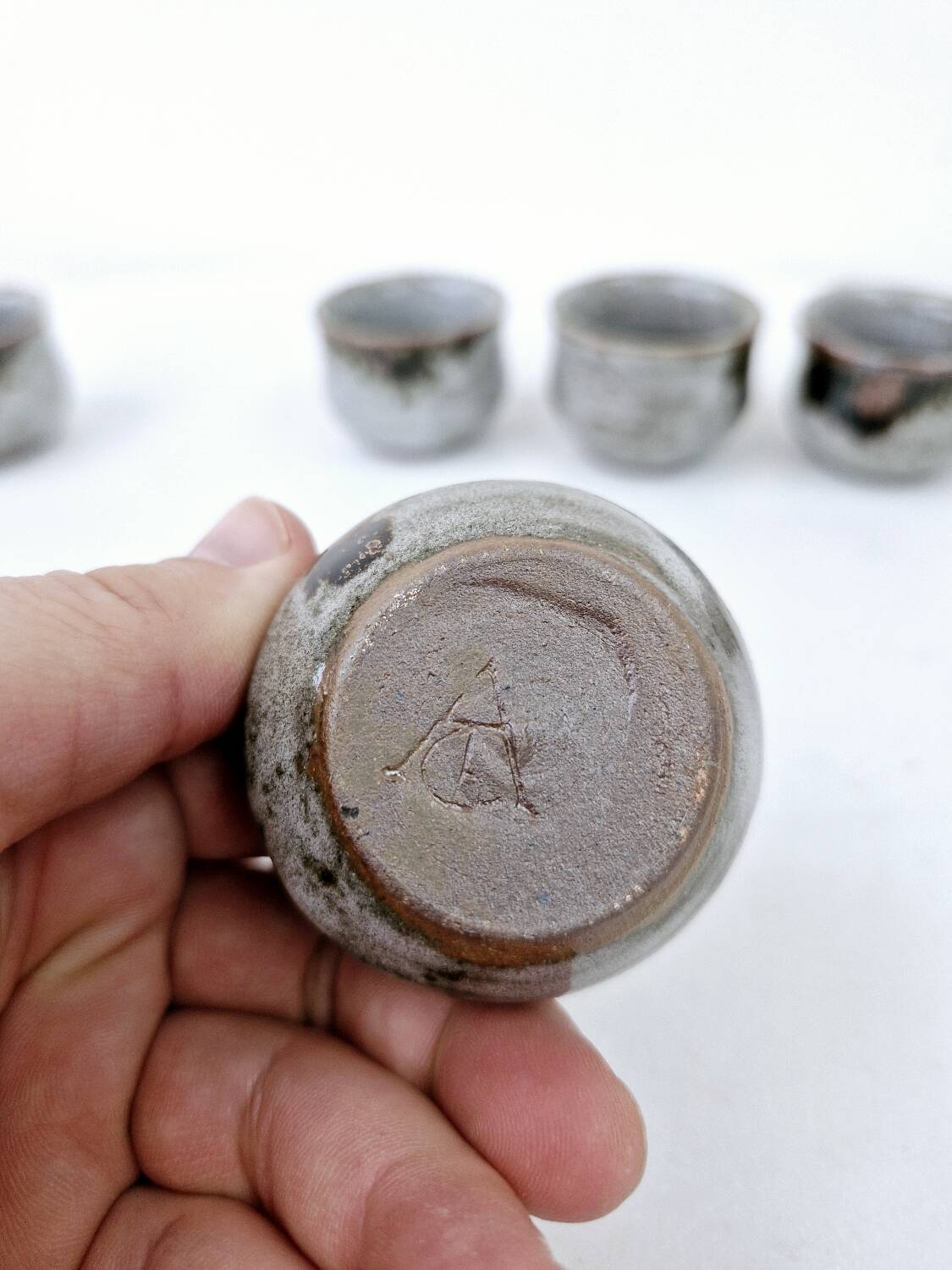 Vintage enameled stoneware service with 6 small bowls and a sugar bowl or sauce bowl