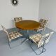 Old round table in solid wood and metal, vintage 70s design