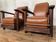 PAIR OF BRUTALIST ARMCHAIRS IN TEAK AND VINTAGE COGNAC LEATHER FROM THE 1950S