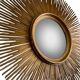 Large sunburst mirror with beveled glass and gilded wood from around 2010.