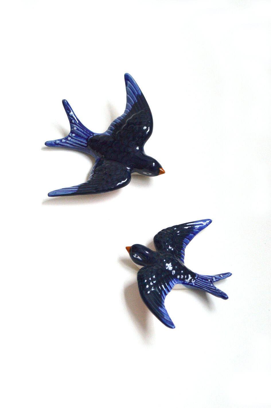 Couple of ceramic wall swallows