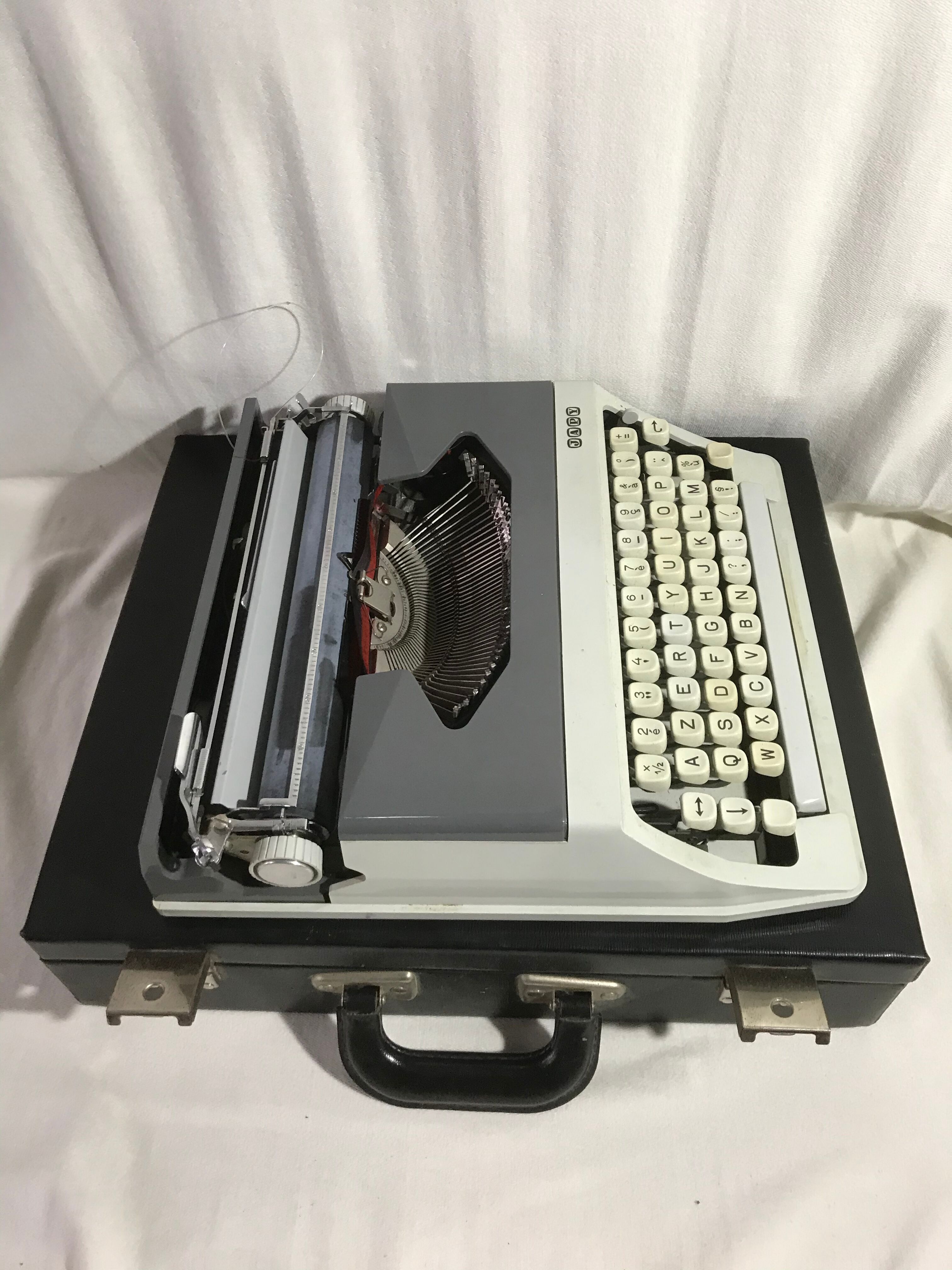 Former HJapy white metal writing machine - grey - vintage black malle