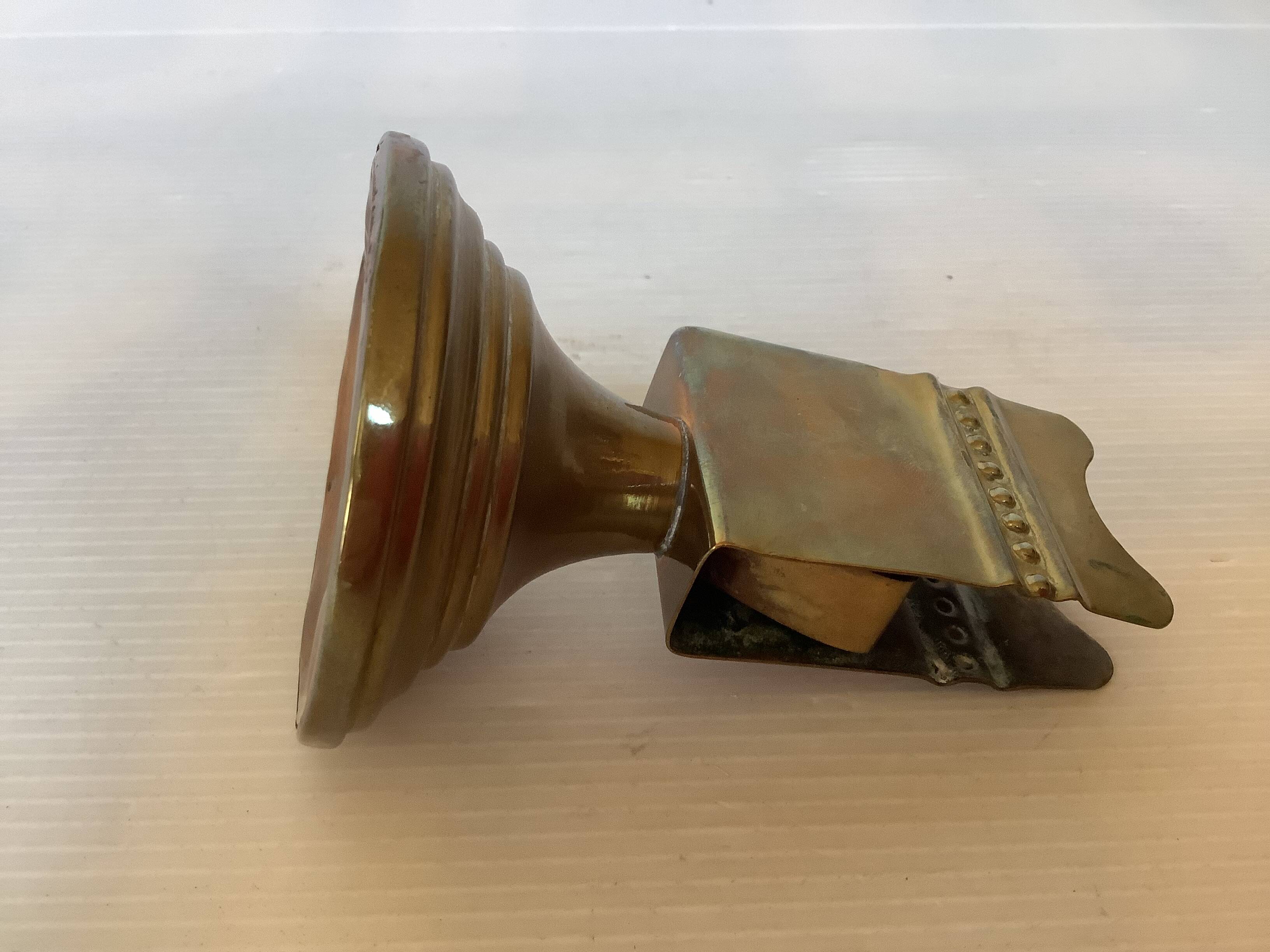 Antique brass match holder with tulip base.