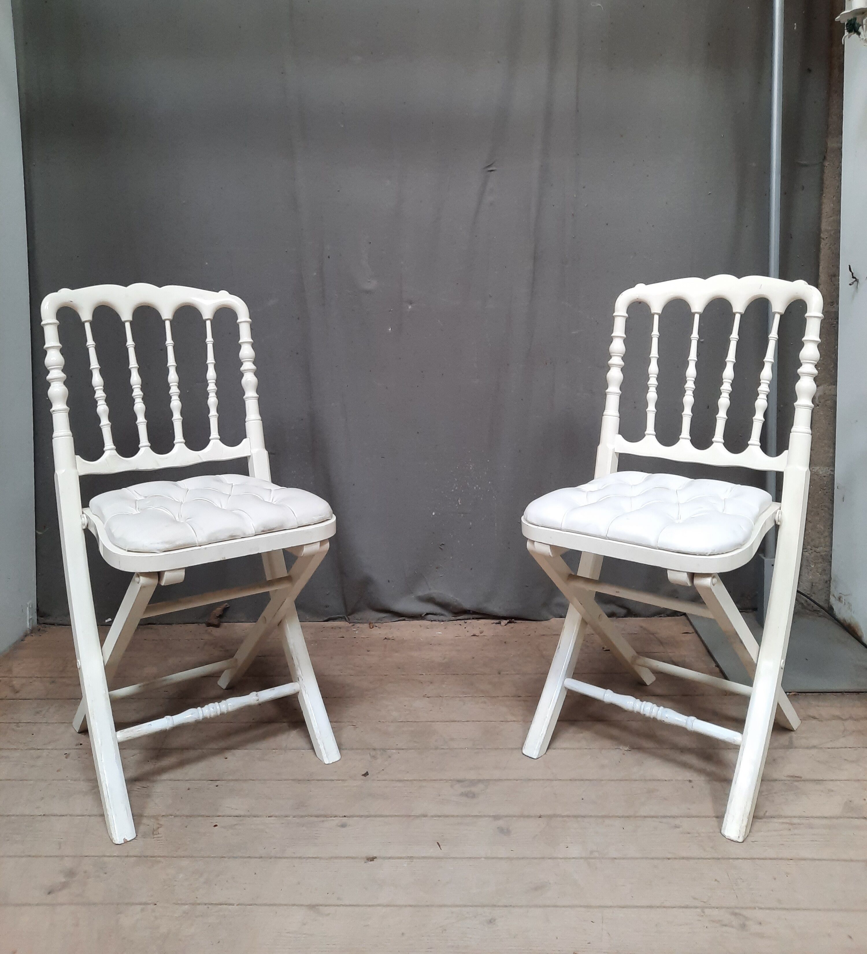 Pair of upholstered folding chairs