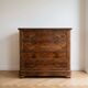 Antique walnut chest of drawers with 4 drawers.
