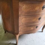 Curved chest of drawers in rosewood and marble marquetry