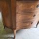 Curved chest of drawers in rosewood and marble marquetry