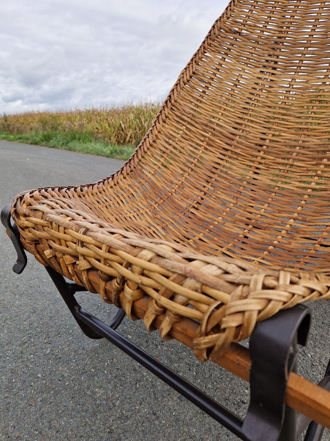 Large vintage metal and wicker armchair