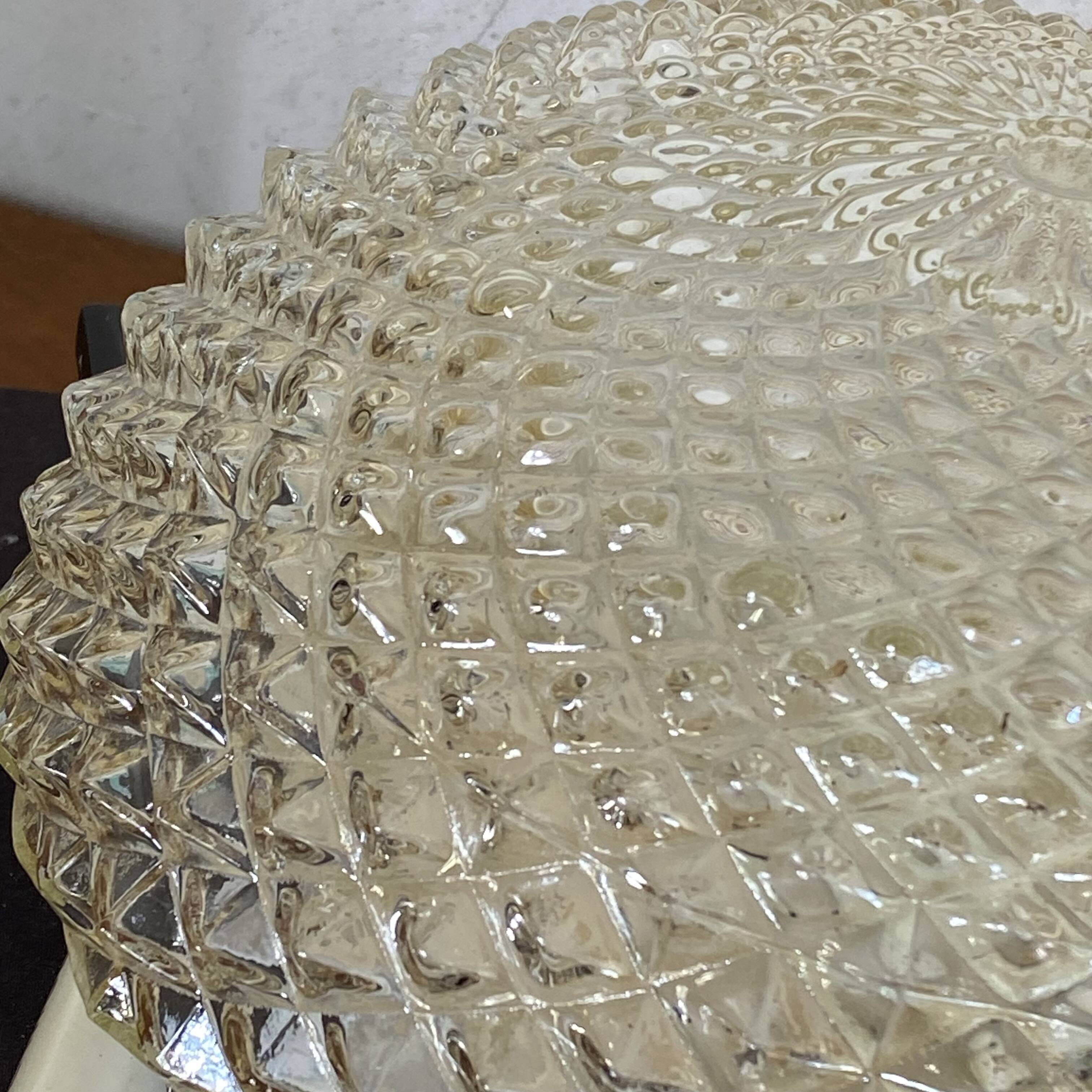 Amber glass wall light or ceiling light with a diamond tip.