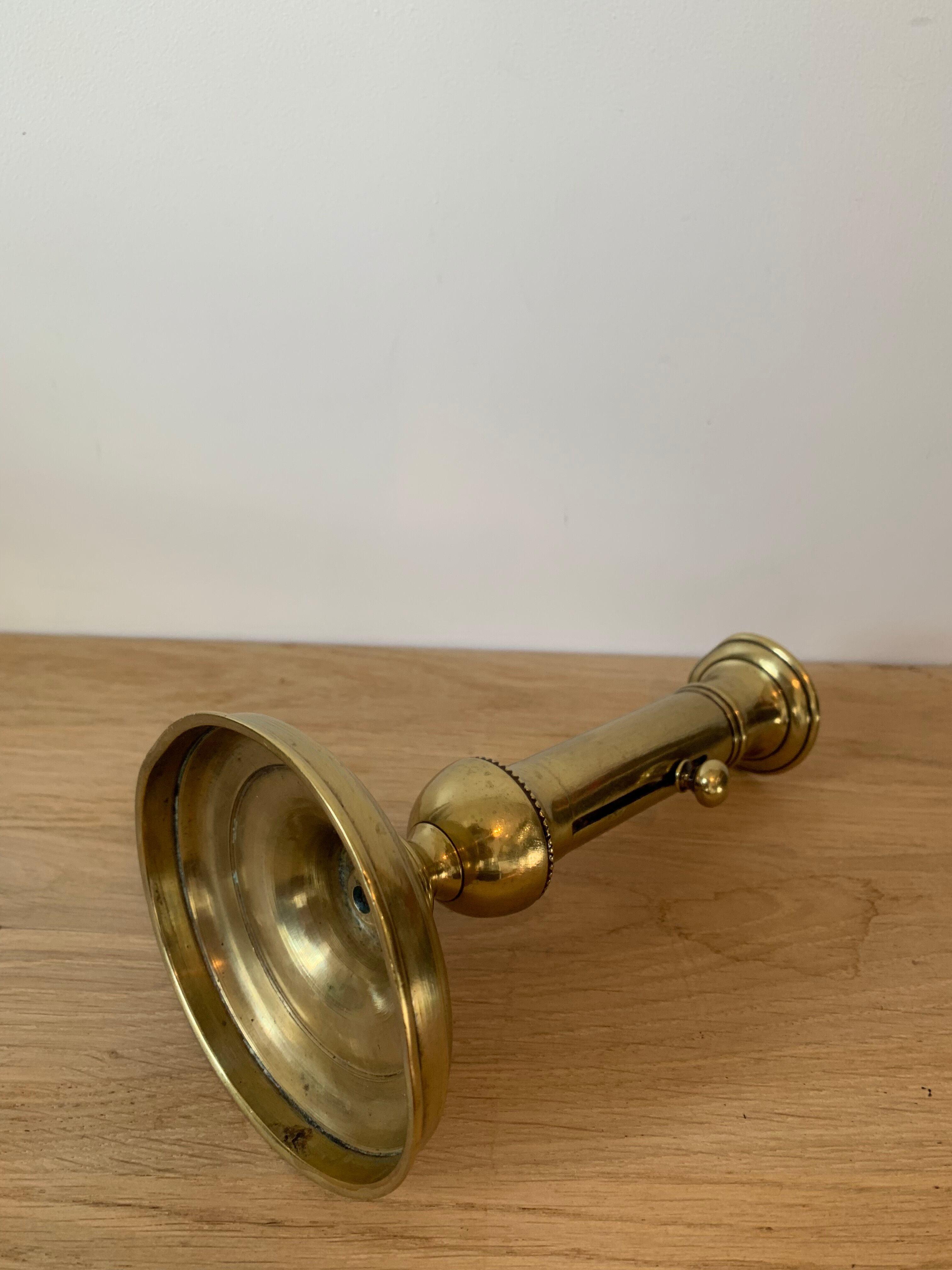 Brass pusher candle holder