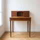 Small vintage wooden desk with a riser.