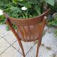 old bistro chair with varnished wooden bars