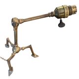 Rare articulated tripod base table lamp in gold-plated brass