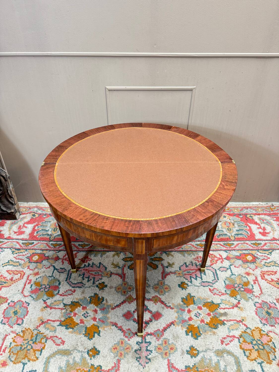 Half-moon game table in marquetry from the Louis XVI period, 18th century.