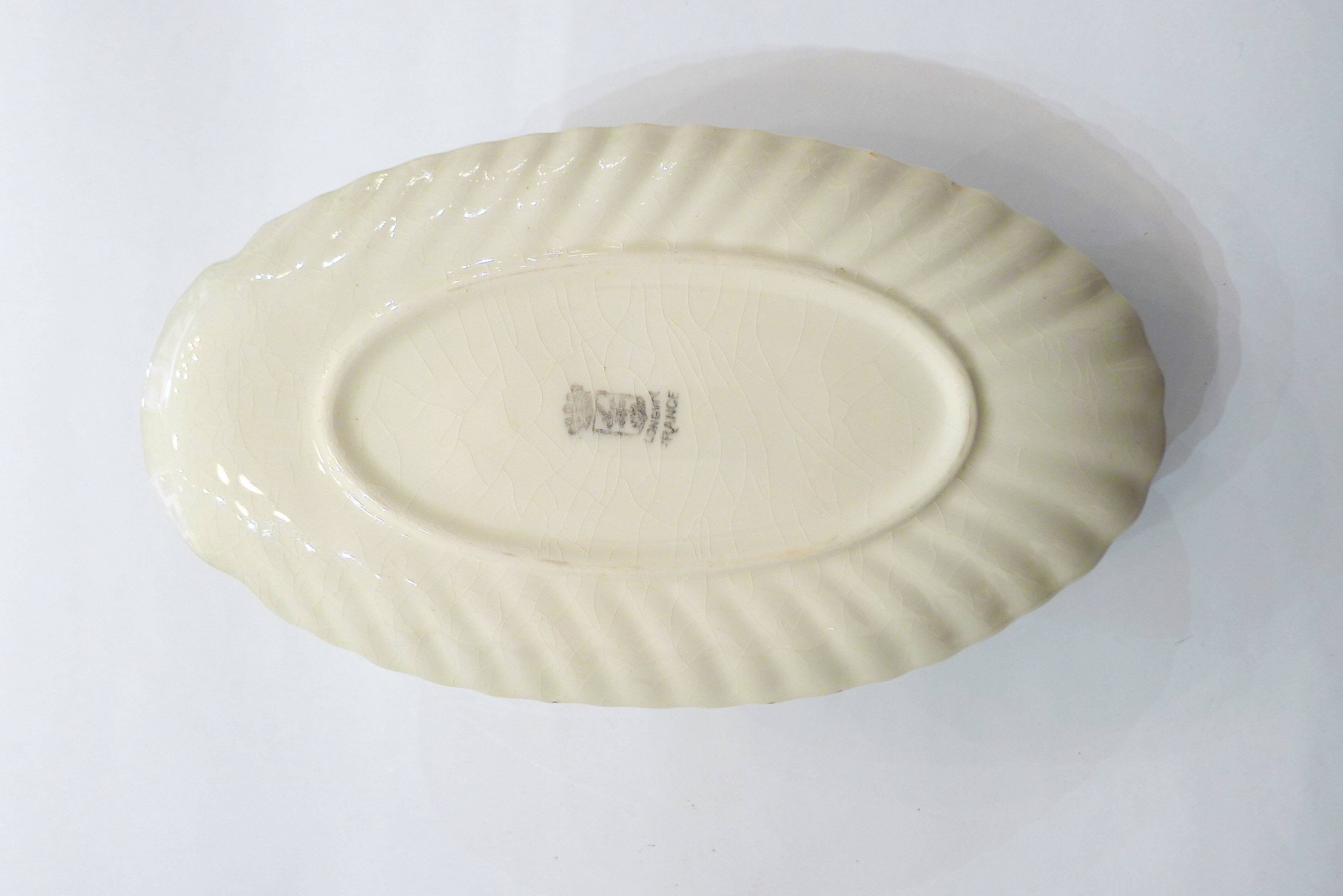 Fish dabbling sauce dish by Longwy