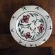 Meyssac plate decorated with flowers on cracked background early twentieth century and its support