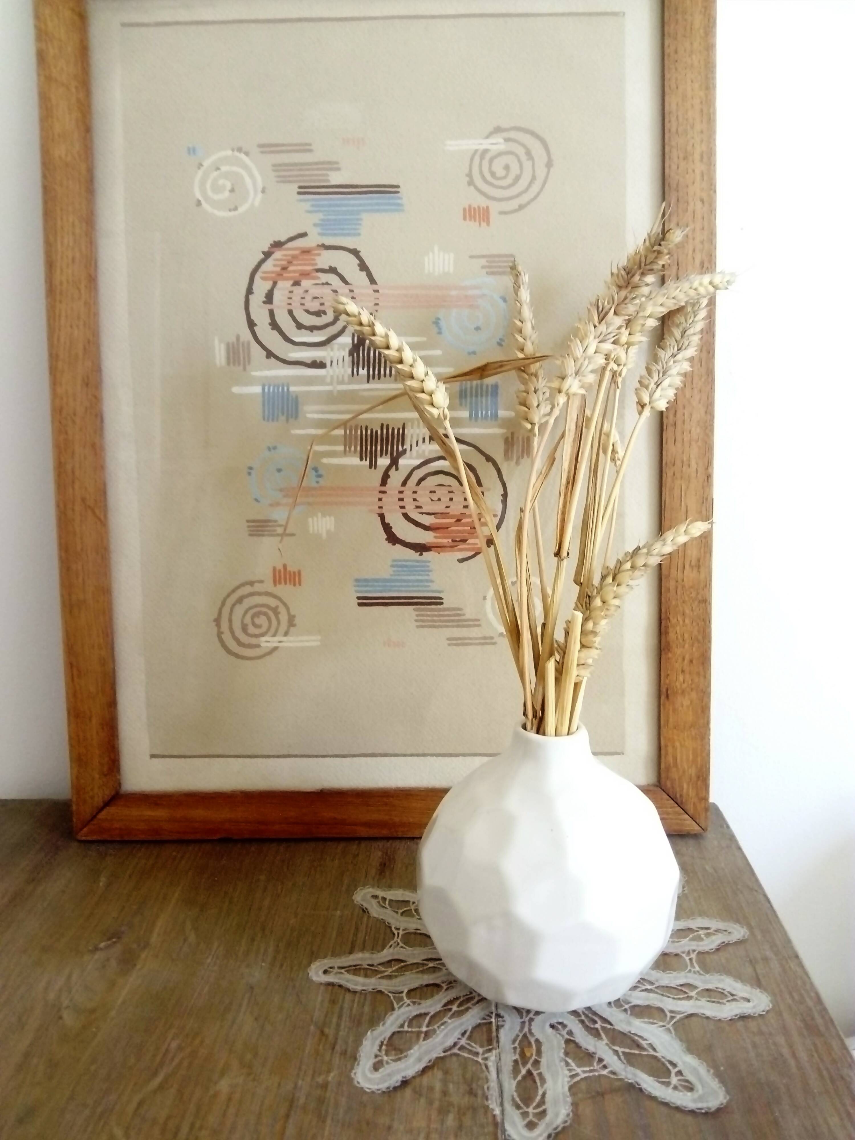 white ceramic faceted design vase