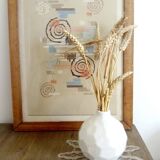 white ceramic faceted design vase